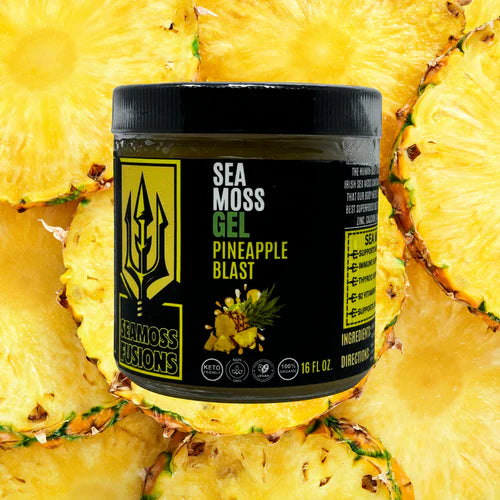 Sea moss gel container labeled 'Pineapple Blast' surrounded by pineapple slices.