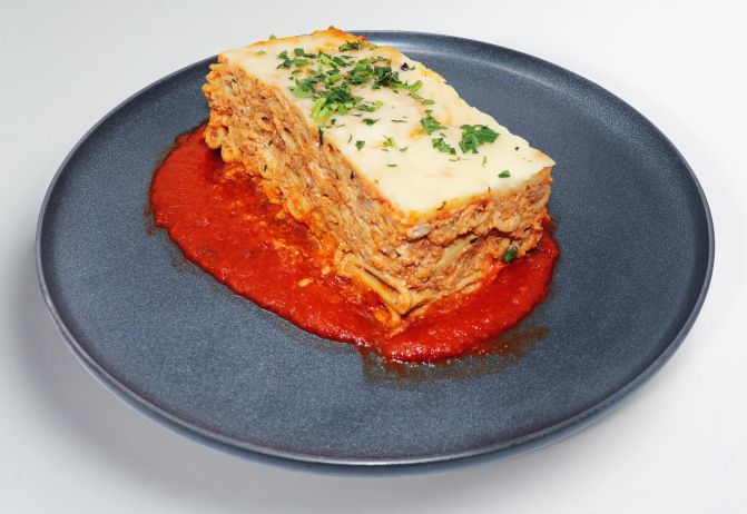 turkey ziti sausage over red sauce on plate - healthy meal from spartan meal preps miami.