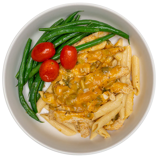 Pasta with cheese, green beans, and cherry tomatoes on a white plate